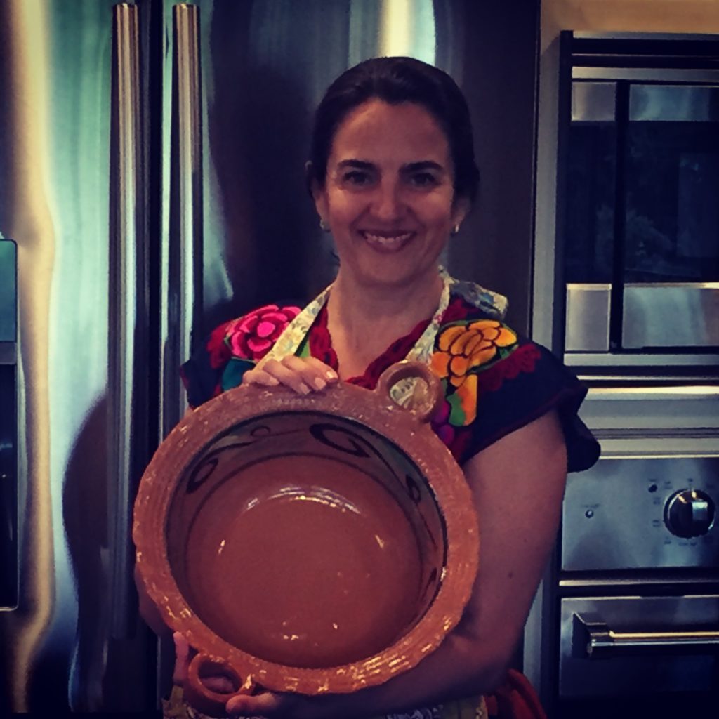 Barbara Santos with Mexican clay pot